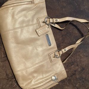 Shimmering tan Coach bag